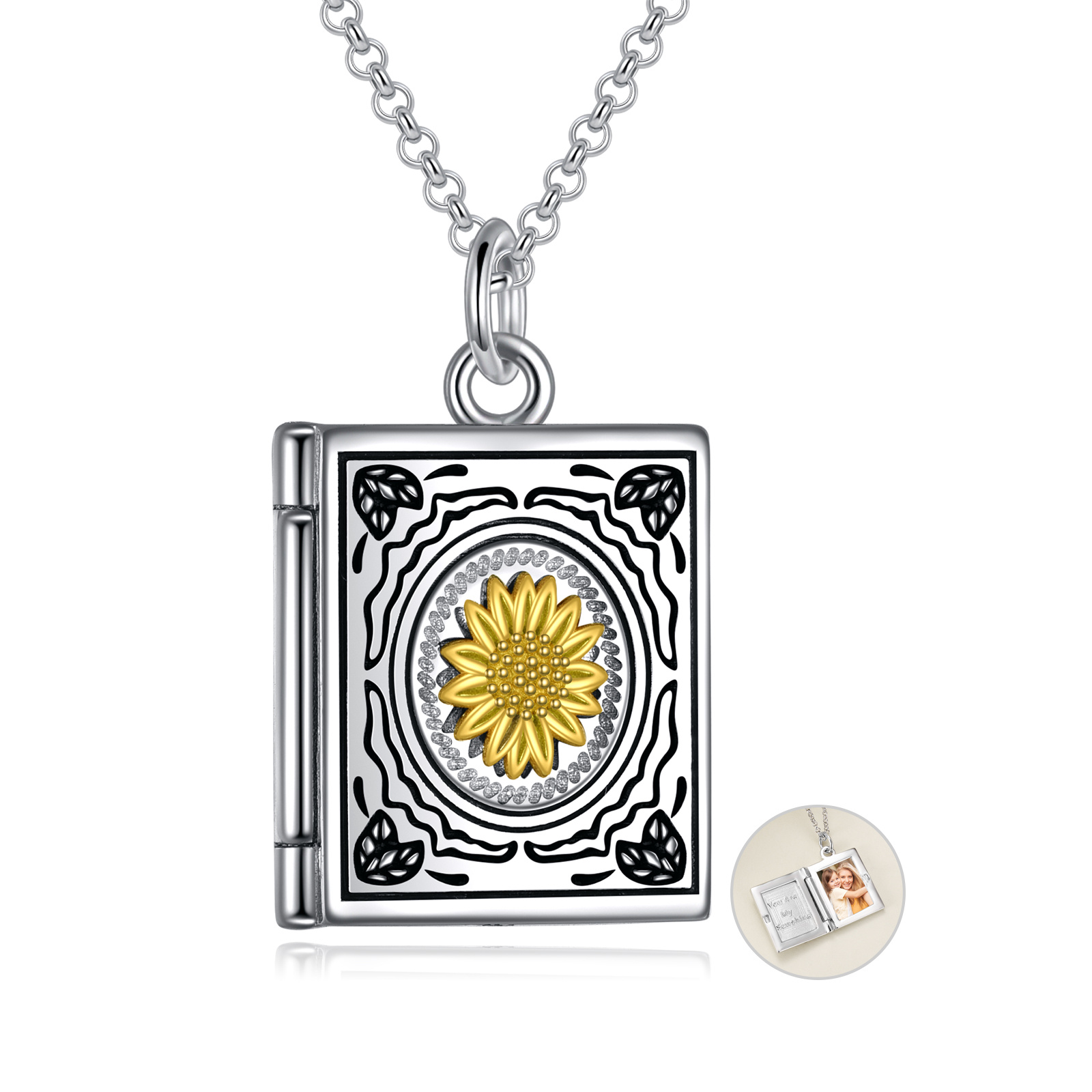 Silver rectangular pendant necklace with an engraved black-and-silver design and a gold sunflower centerpiece on a silver chain.
