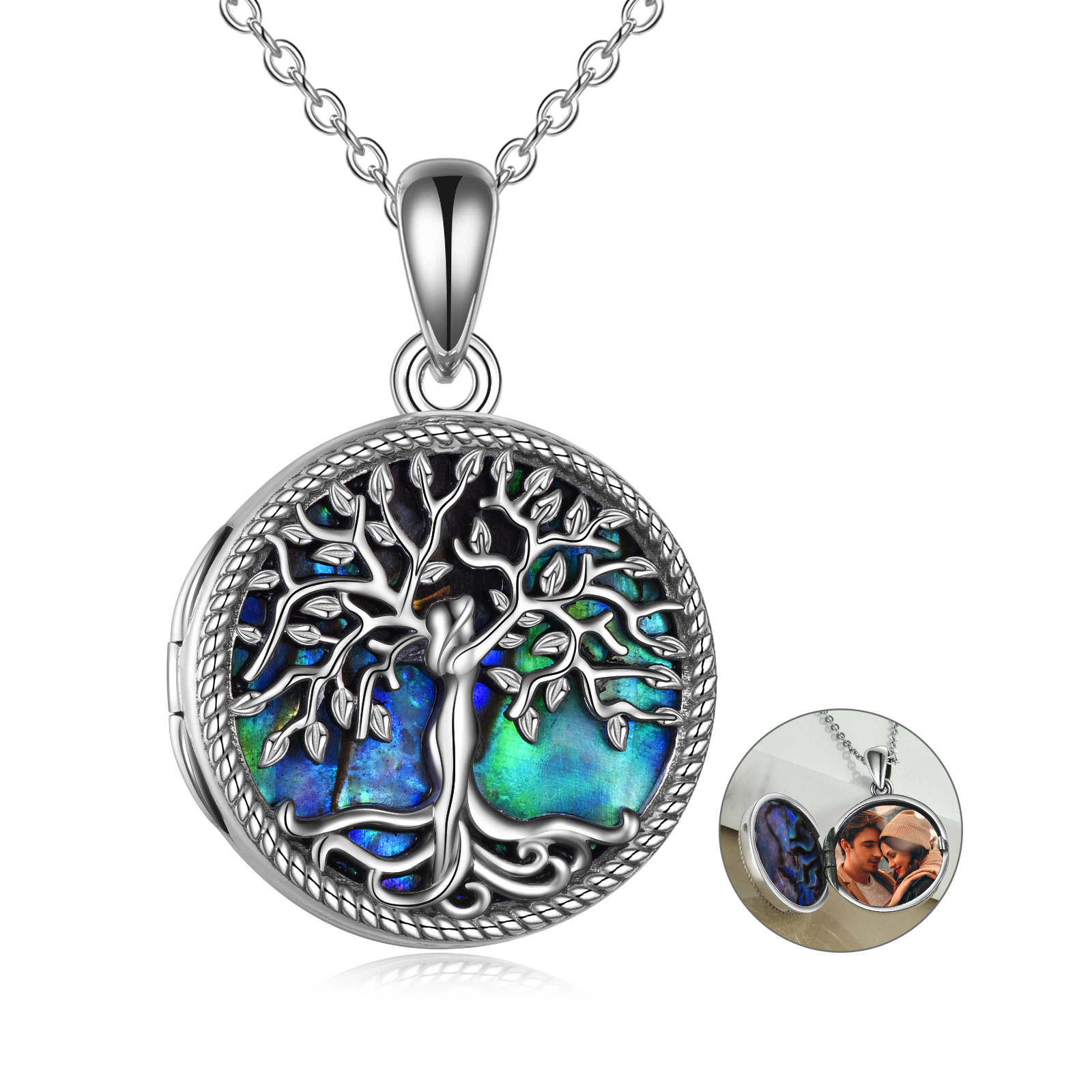 Silver tree-of-life pendant with iridescent blue-green background on a silver chain.