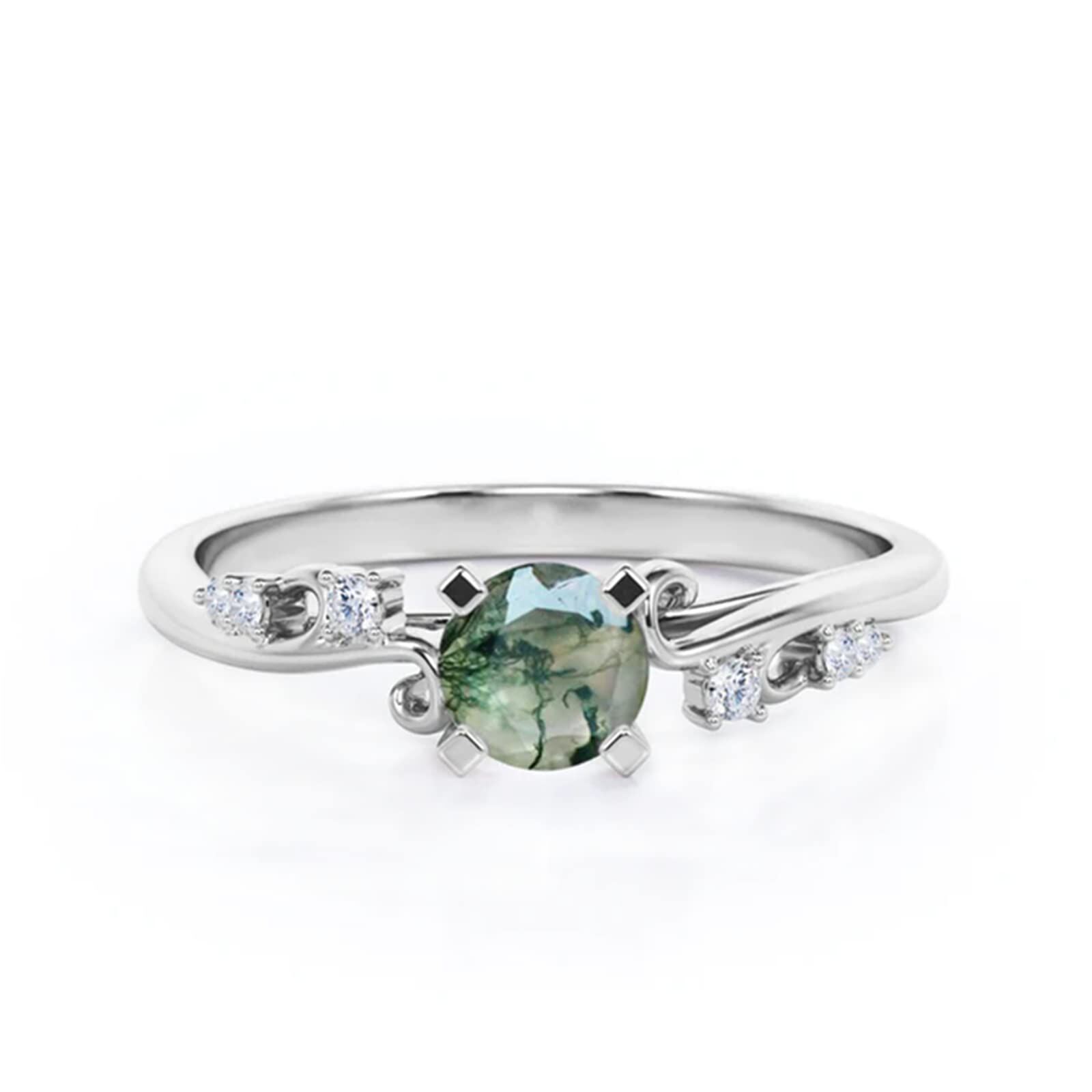 Silver ring featuring an oval green gemstone with diamond accents on each side nestled in a sleek band.