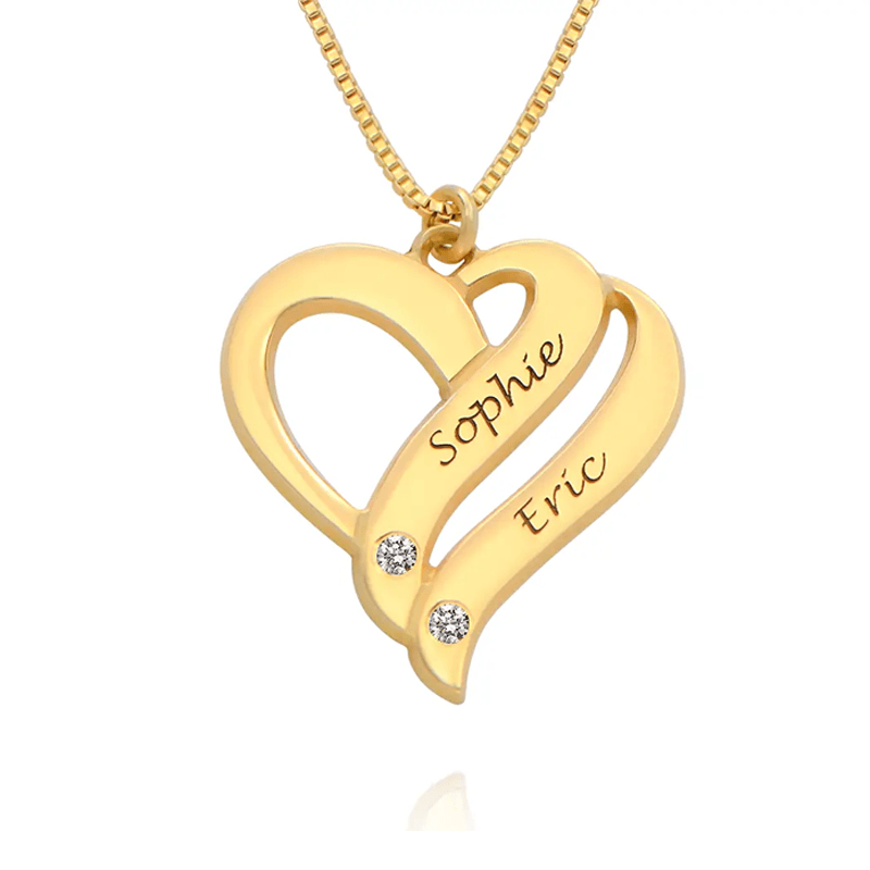 Gold heart pendant necklace with intertwined loops, engraved names Sophie and Eric, and two diamond accents on a chain