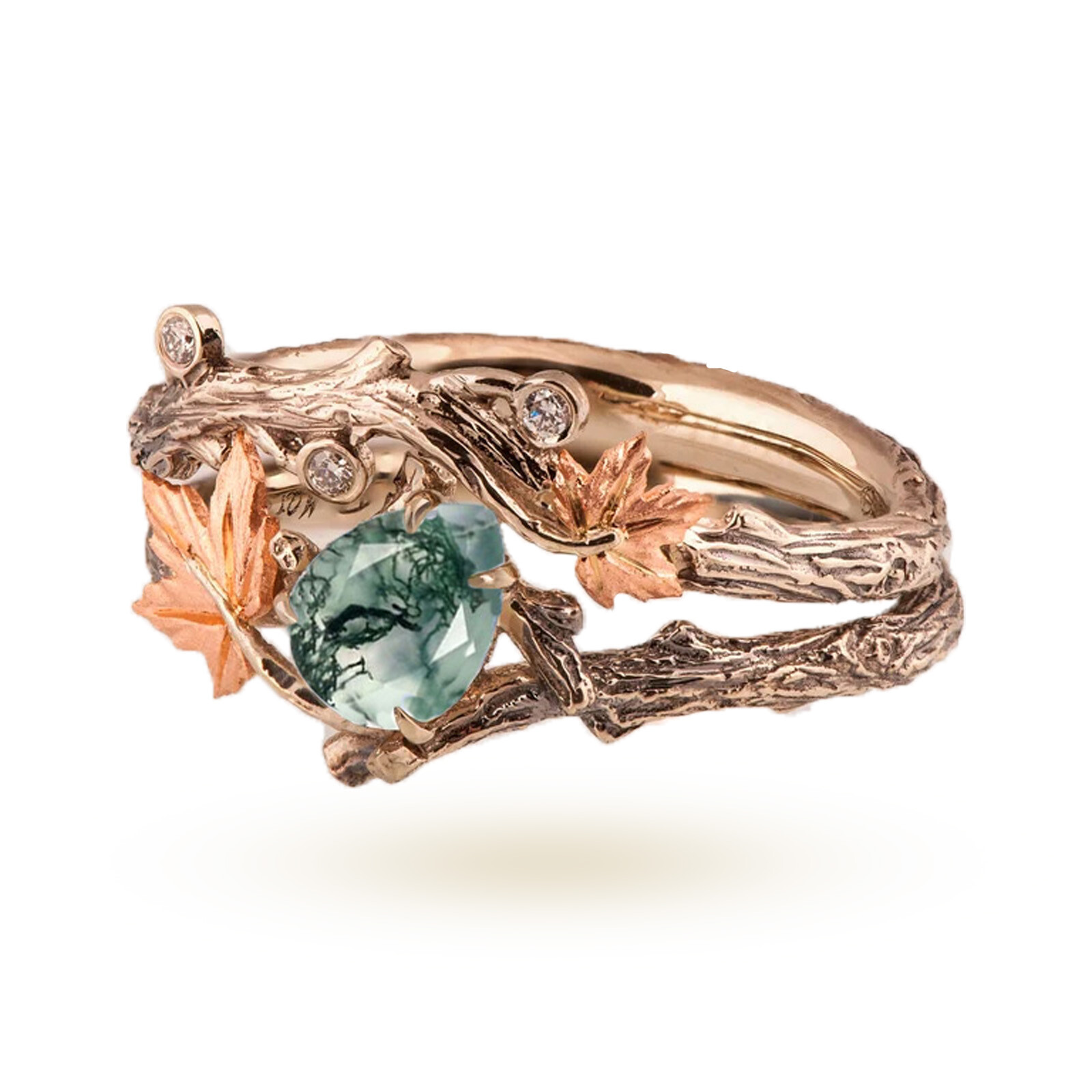 Gold ring with a large green gemstone and leaf-inspired detailing, accented by small diamonds on a botanical design.