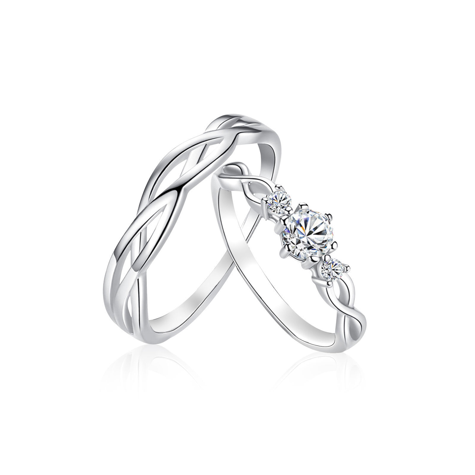 Close-up of two intertwined silver rings, one featuring a prominent diamond and smaller stones on a white background.