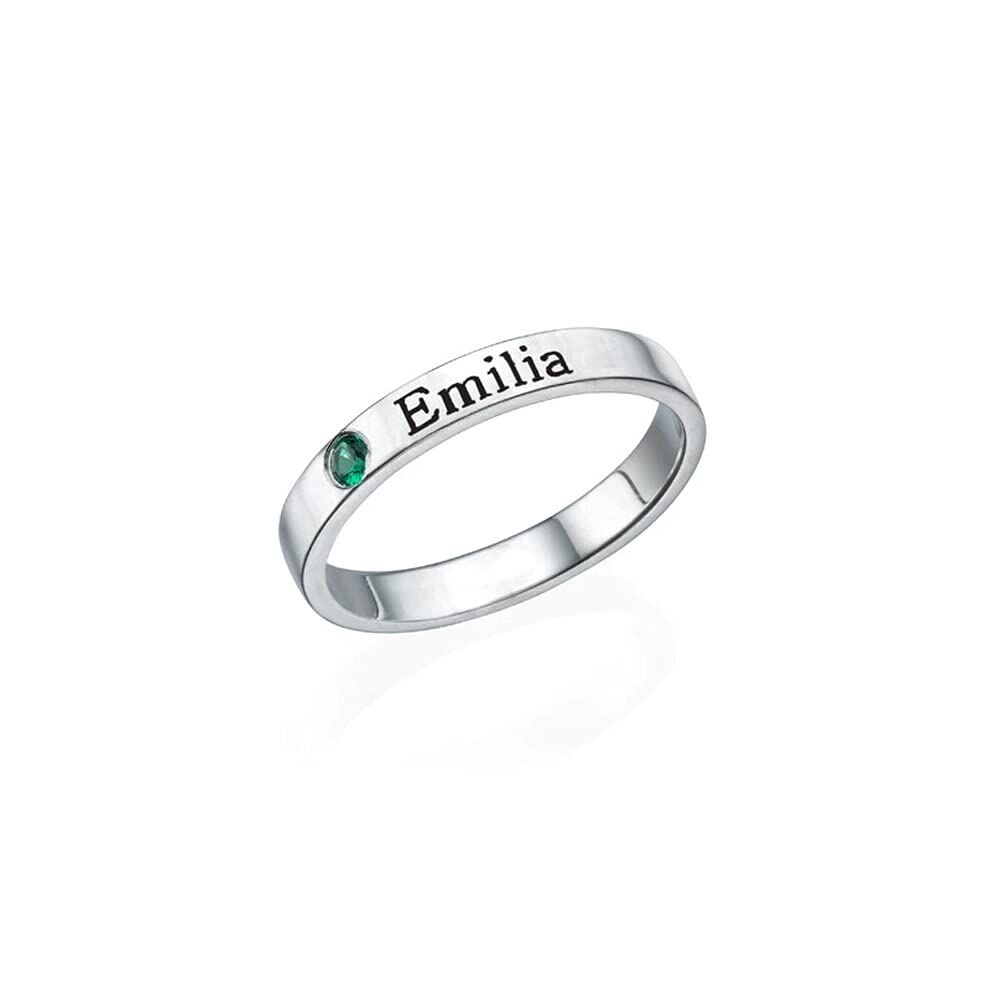 Silver ring with engraved name 'Emilia' on the band and a small green gemstone set into the side