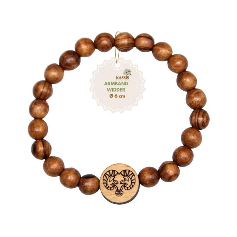 Wooden beaded bracelet with a round pendant showing ram heads and a hanging tag reading 'KASSIS Armband Widder Ø 6 cm'