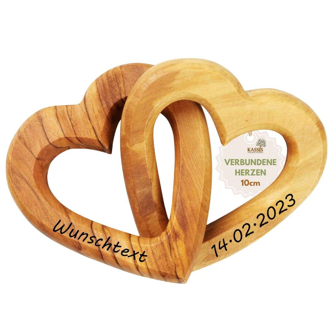 Two intertwined wooden hearts with a personalized inscription and date, a keepsake gift slam.