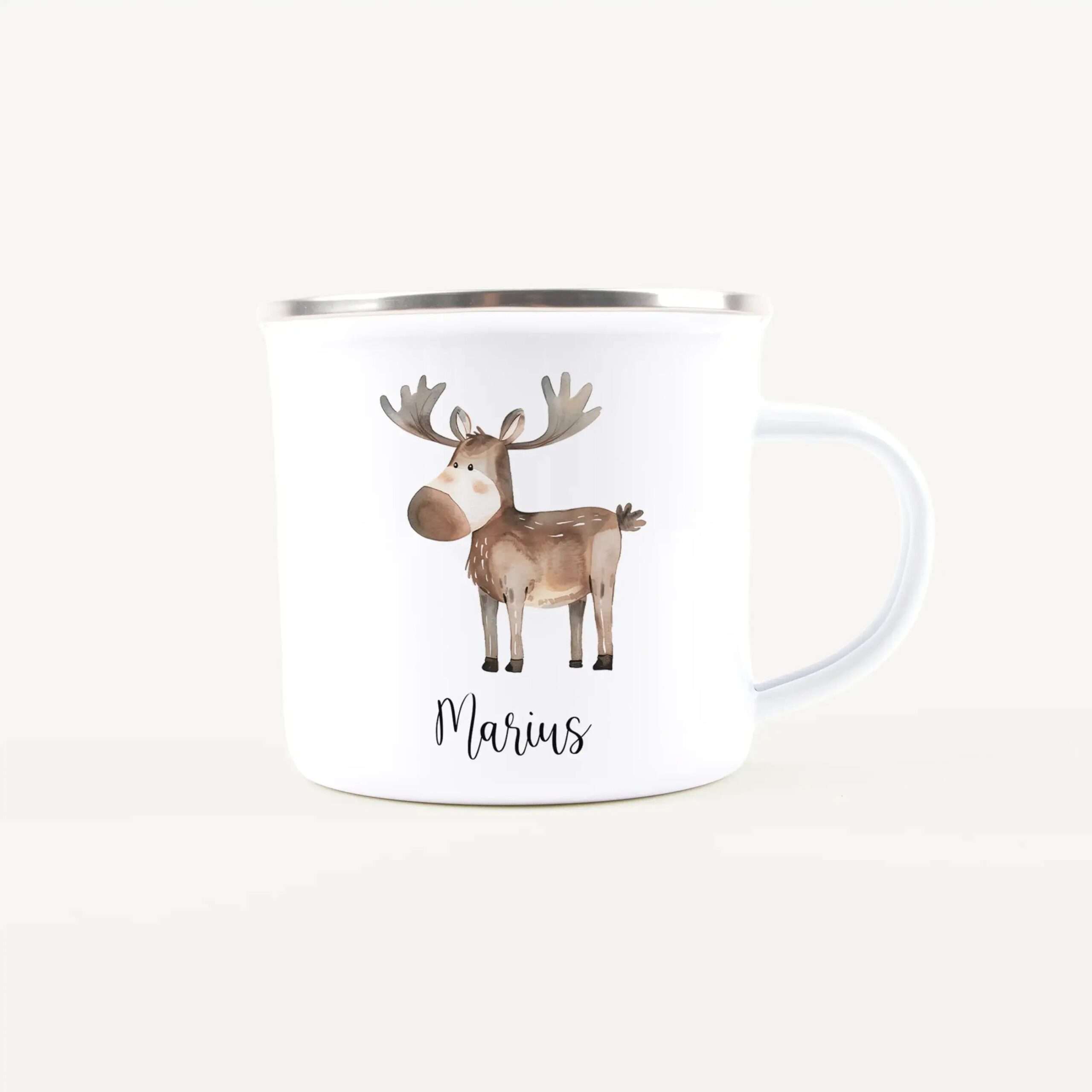 White ceramic mug featuring a watercolor reindeer illustration and the name 'Marius' in cursive.