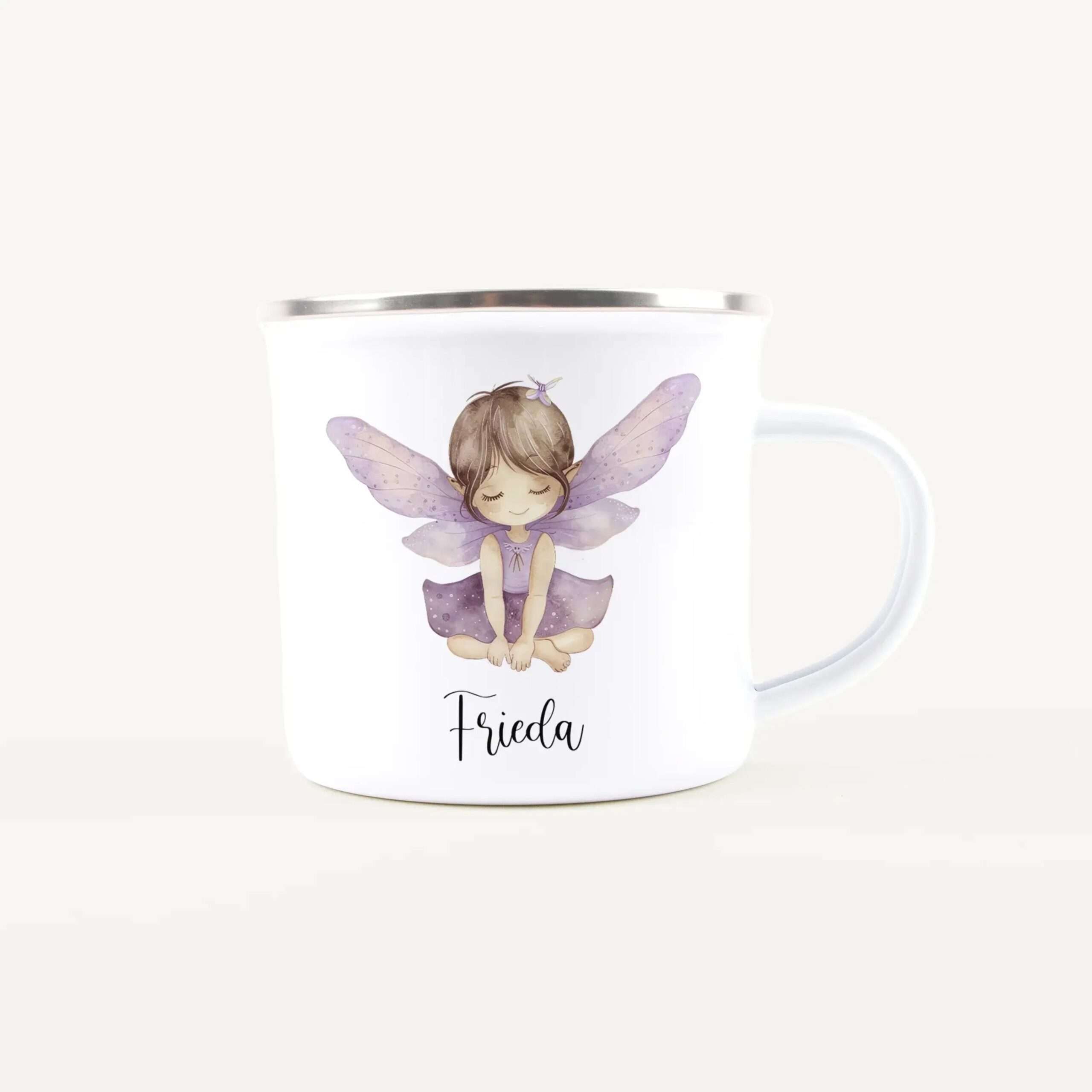 White ceramic mug showing a pastel illustration of a small fairy girl with purple wings.