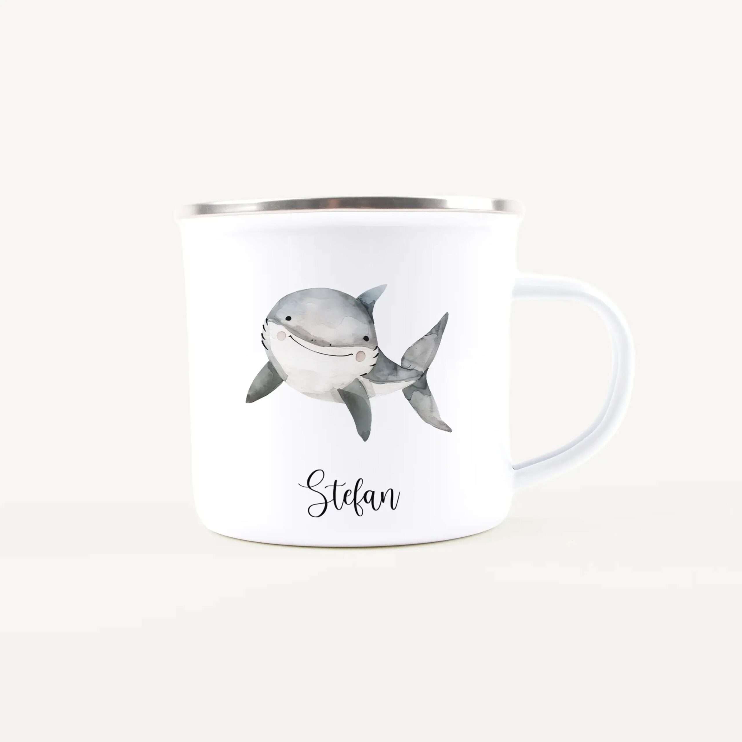 White ceramic mug with a watercolor shark illustration and the name Stefan in script.