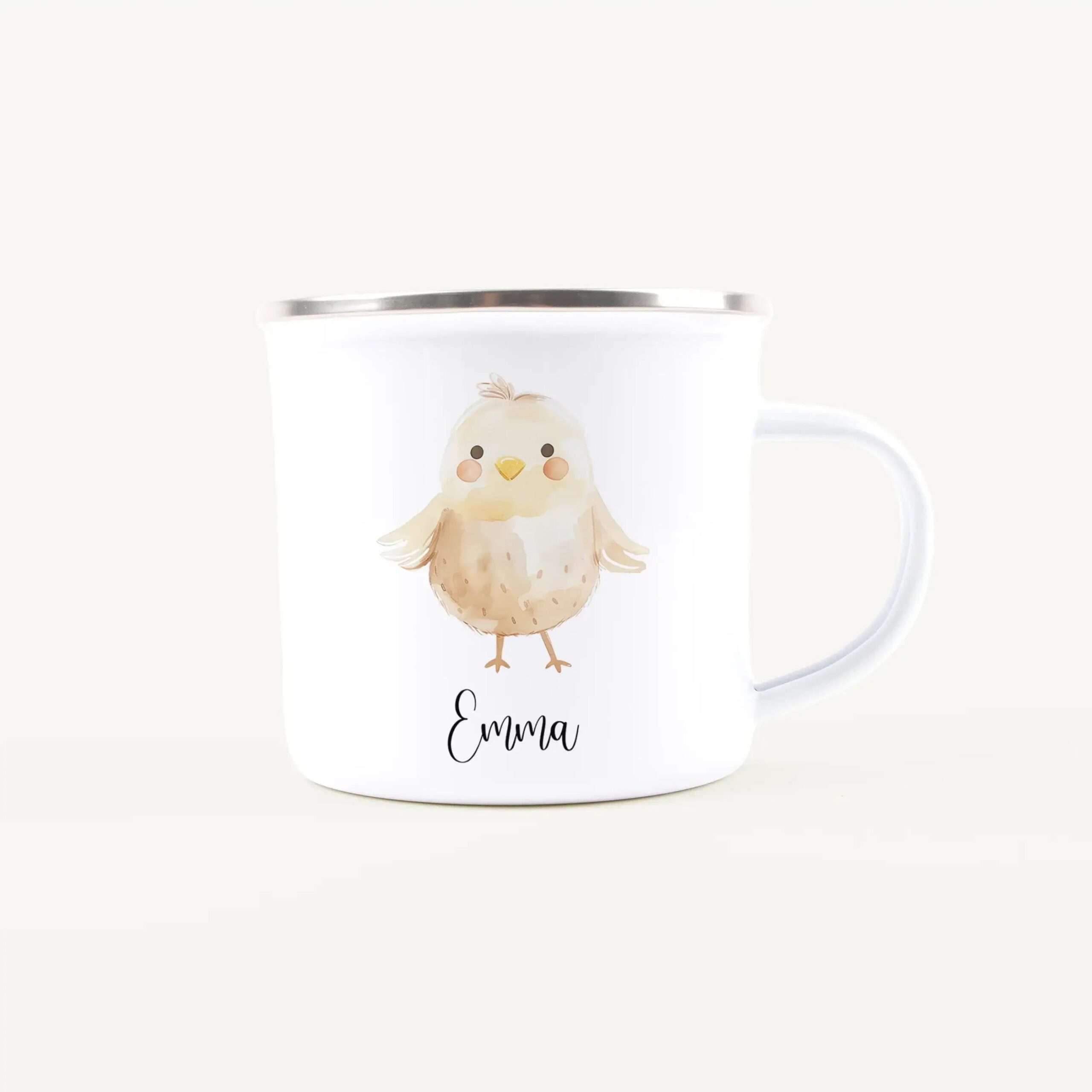 White ceramic mug with a cute chick illustration and the name Emma visible on the front.