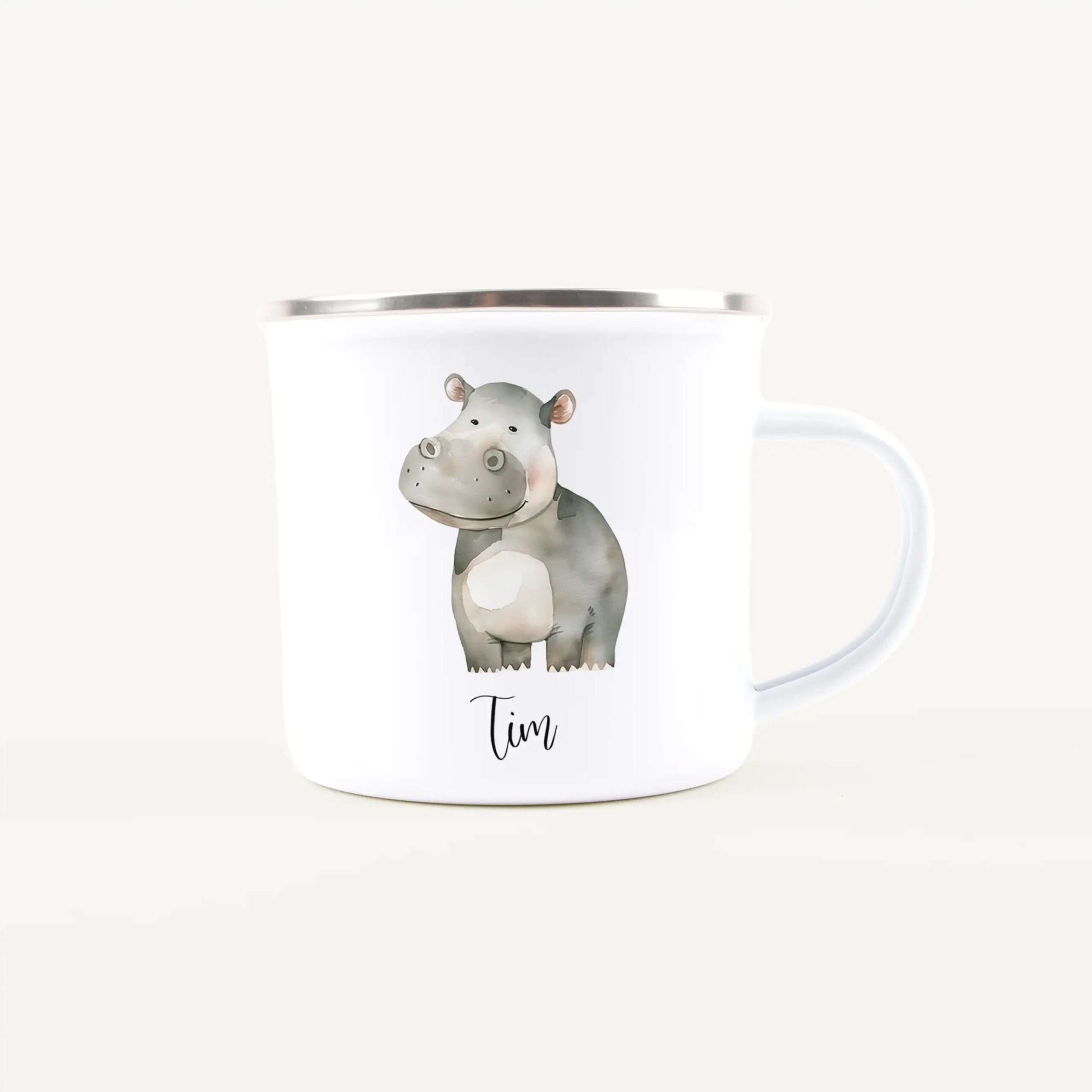 White ceramic mug featuring a cartoon hippo illustration along the side.