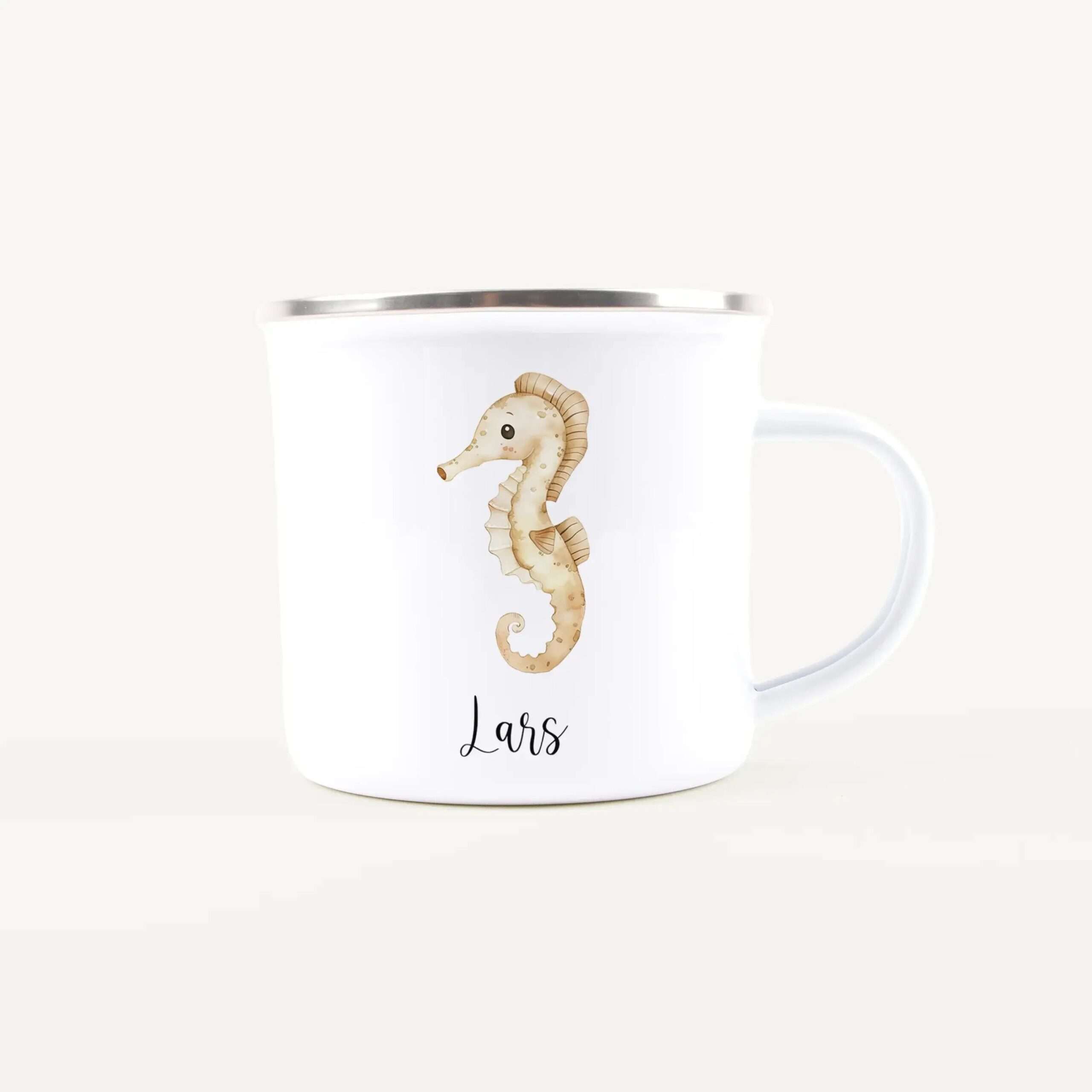 White ceramic mug with a beige seahorse illustration and a silver rim, visible handle edge to the right.