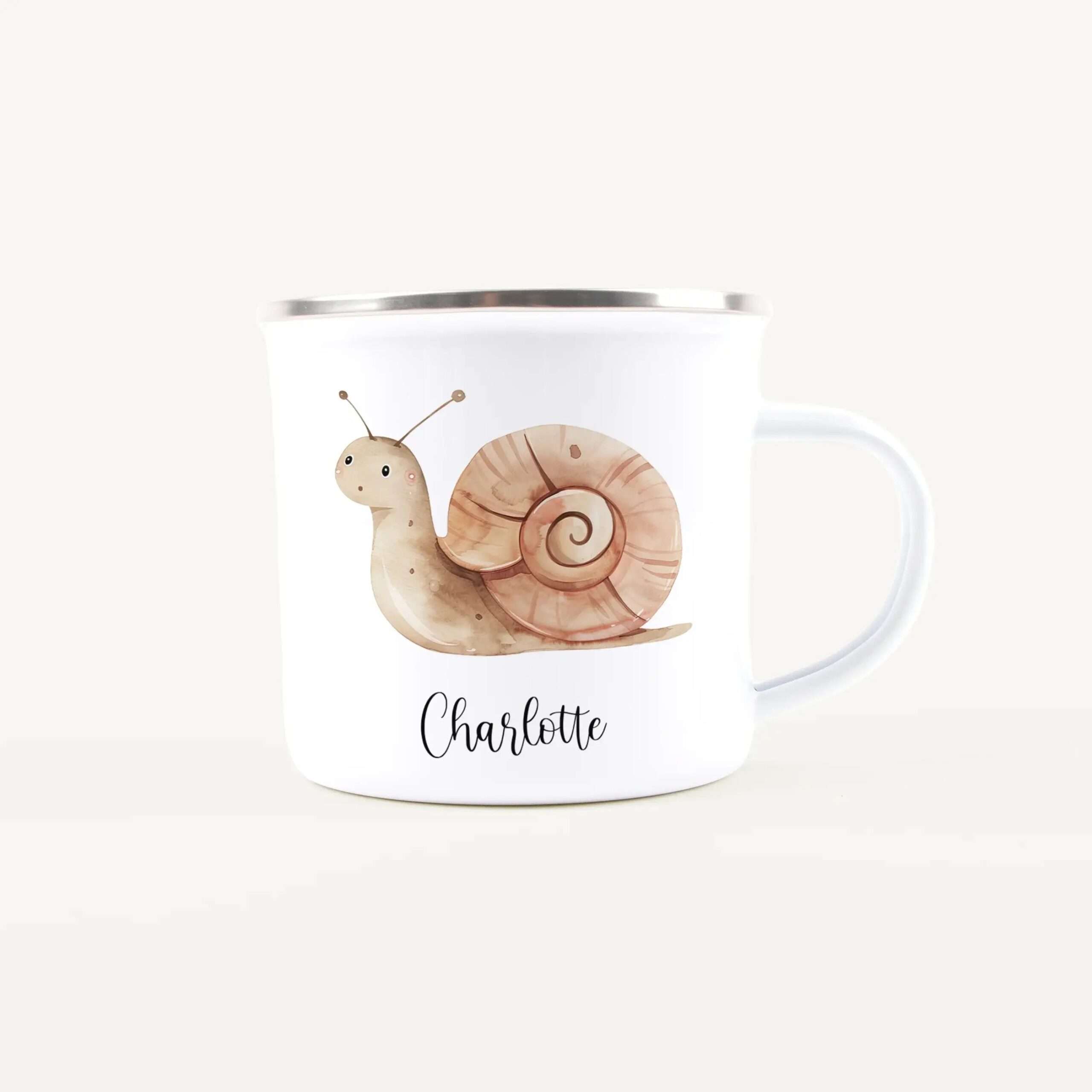 White ceramic mug adorned with cartoon snails and the name Charlotte in elegant script on the front.