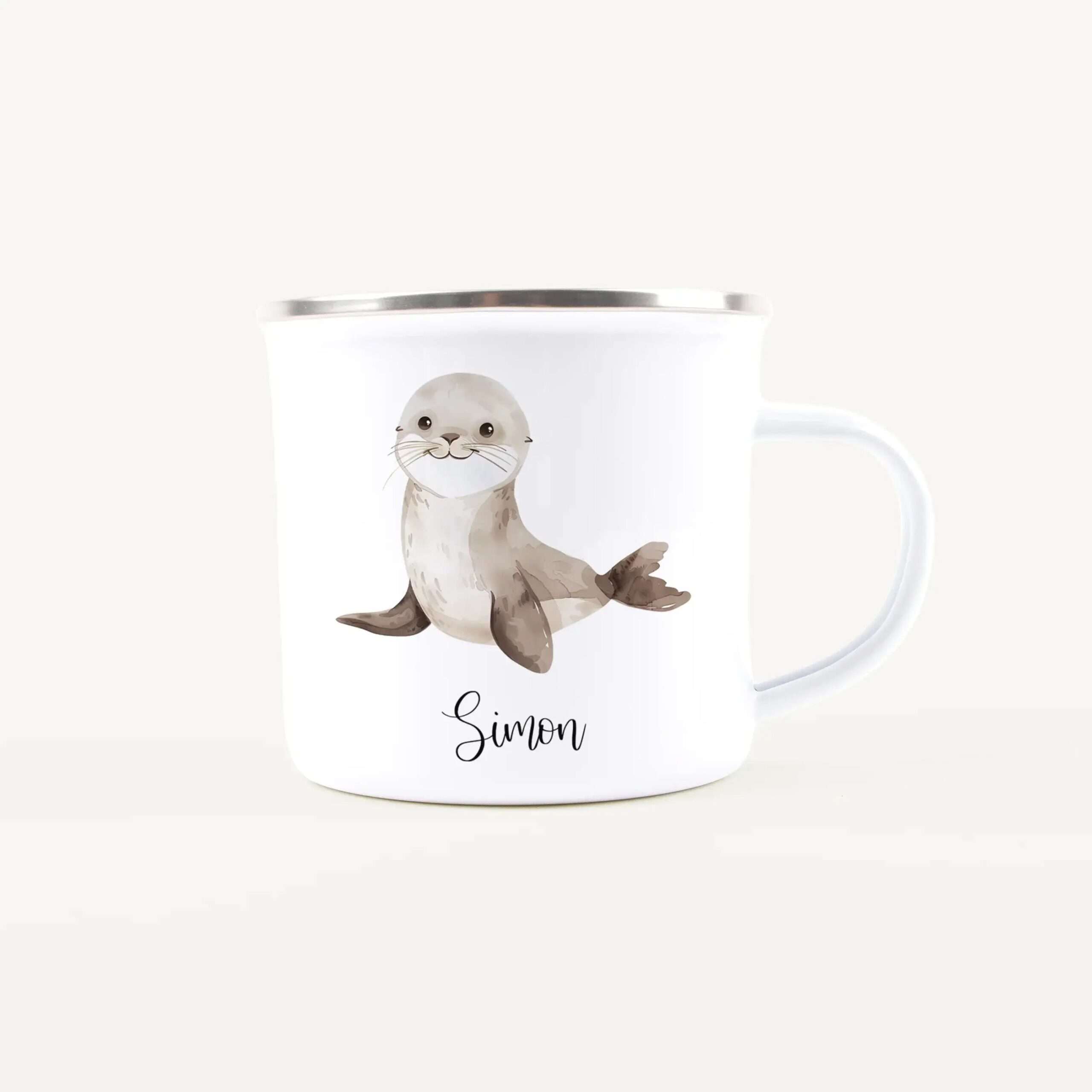 White mug with a seal illustration and the name Simon in cursive.