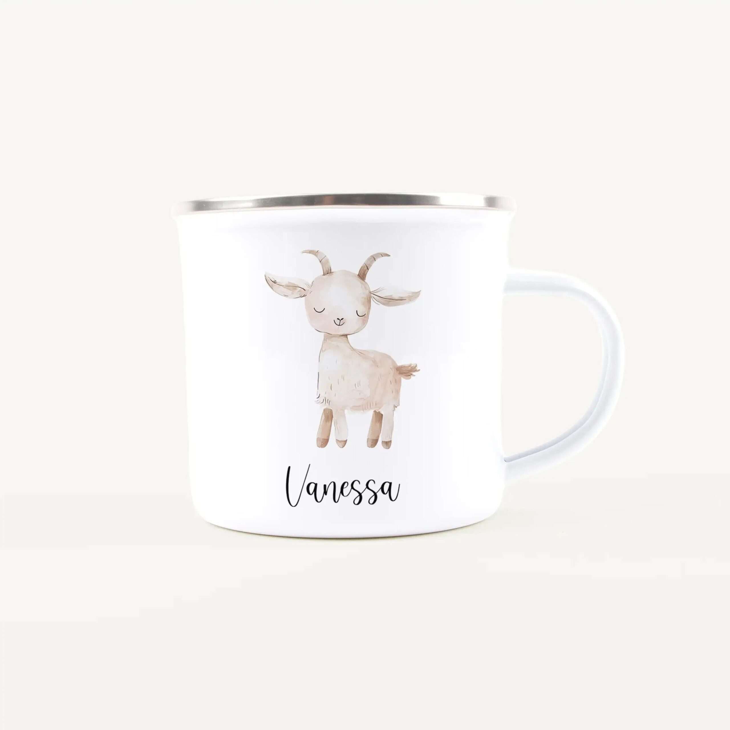 White mug featuring a watercolor-style drawing of a smiling goat and the name Vanessa in cursive script beneath it.