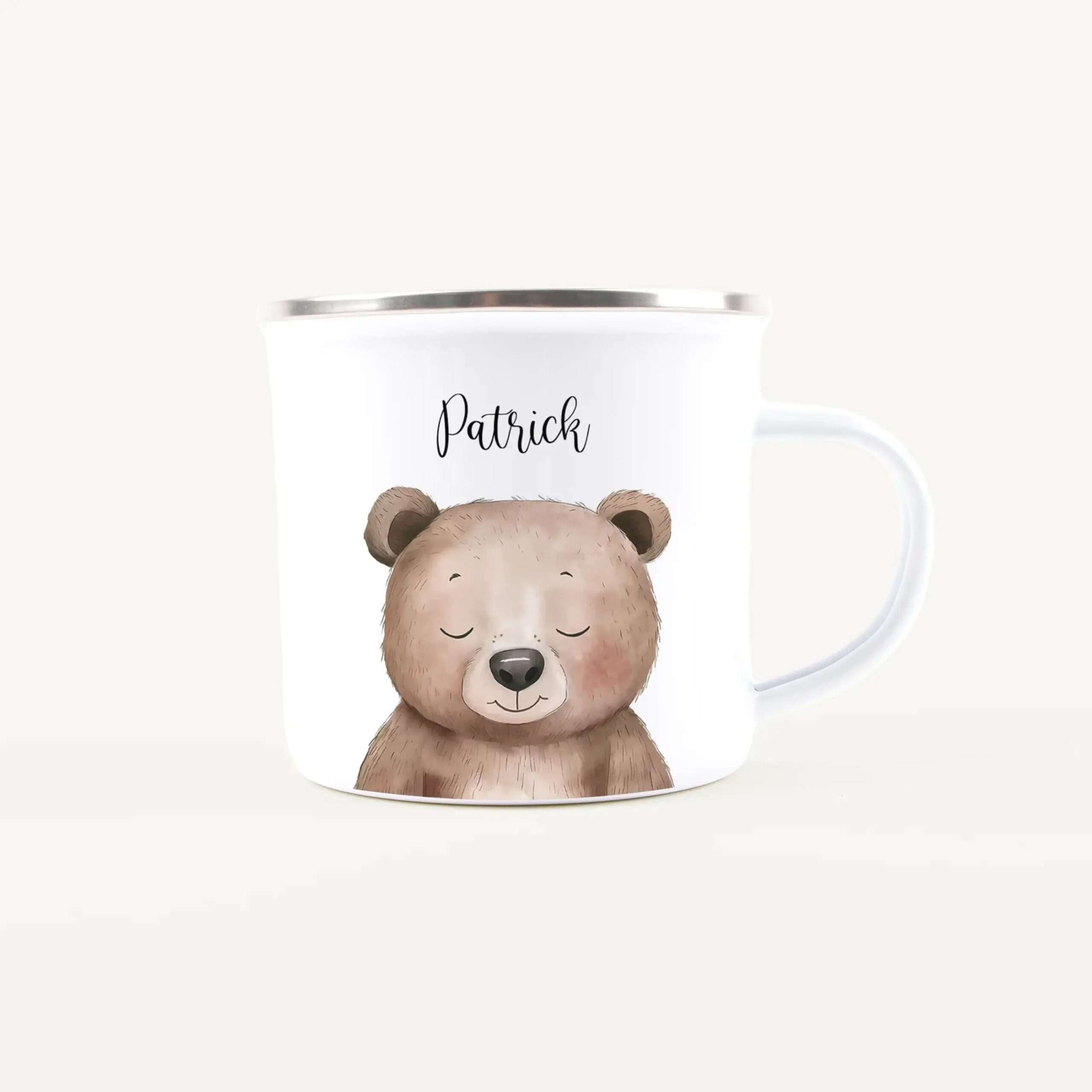 White ceramic mug showing a cute sleeping bear illustration and the name Patrick on the side, in a personalized design.