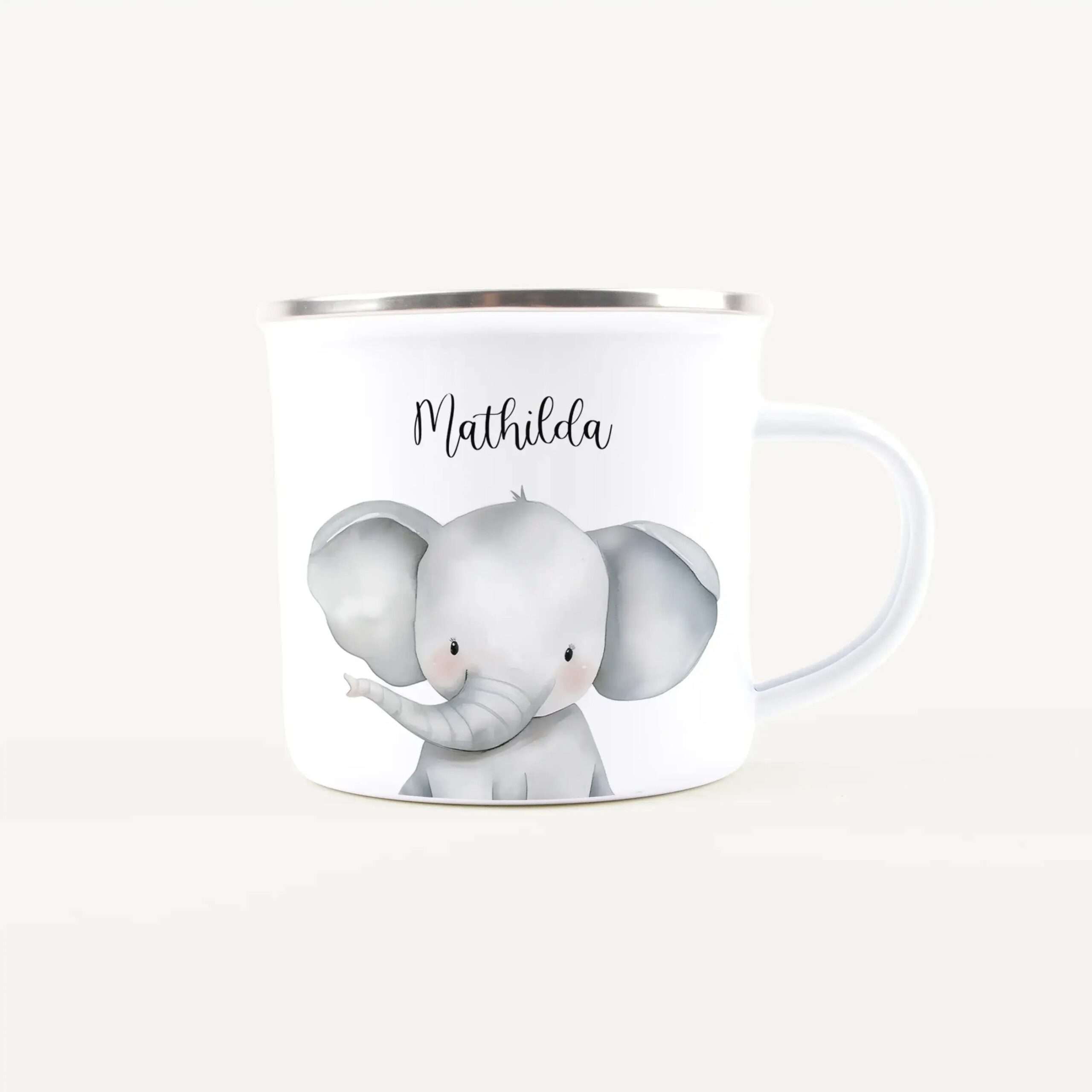 White ceramic mug featuring a cute gray elephant illustration and the name Mathilda printed on it