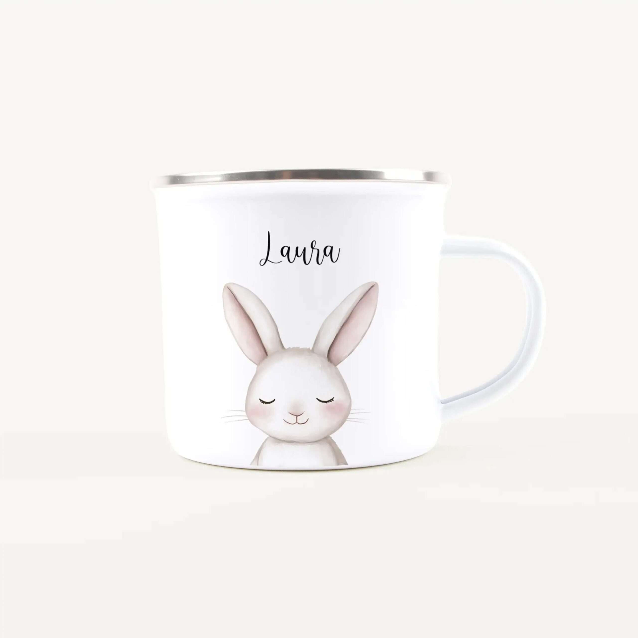 White ceramic mug featuring a sleeping bunny illustration and the name Laura printed on it.