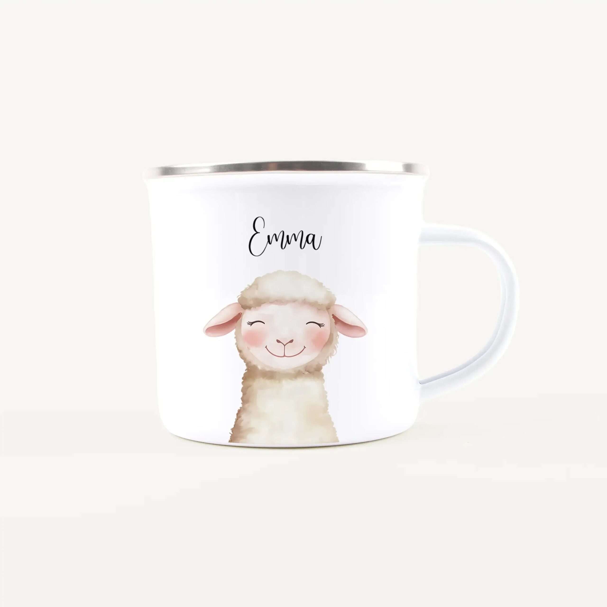 White ceramic mug with a cute cartoon sheep and the name Emma; silver rim visible at the top and the handle on the right side.