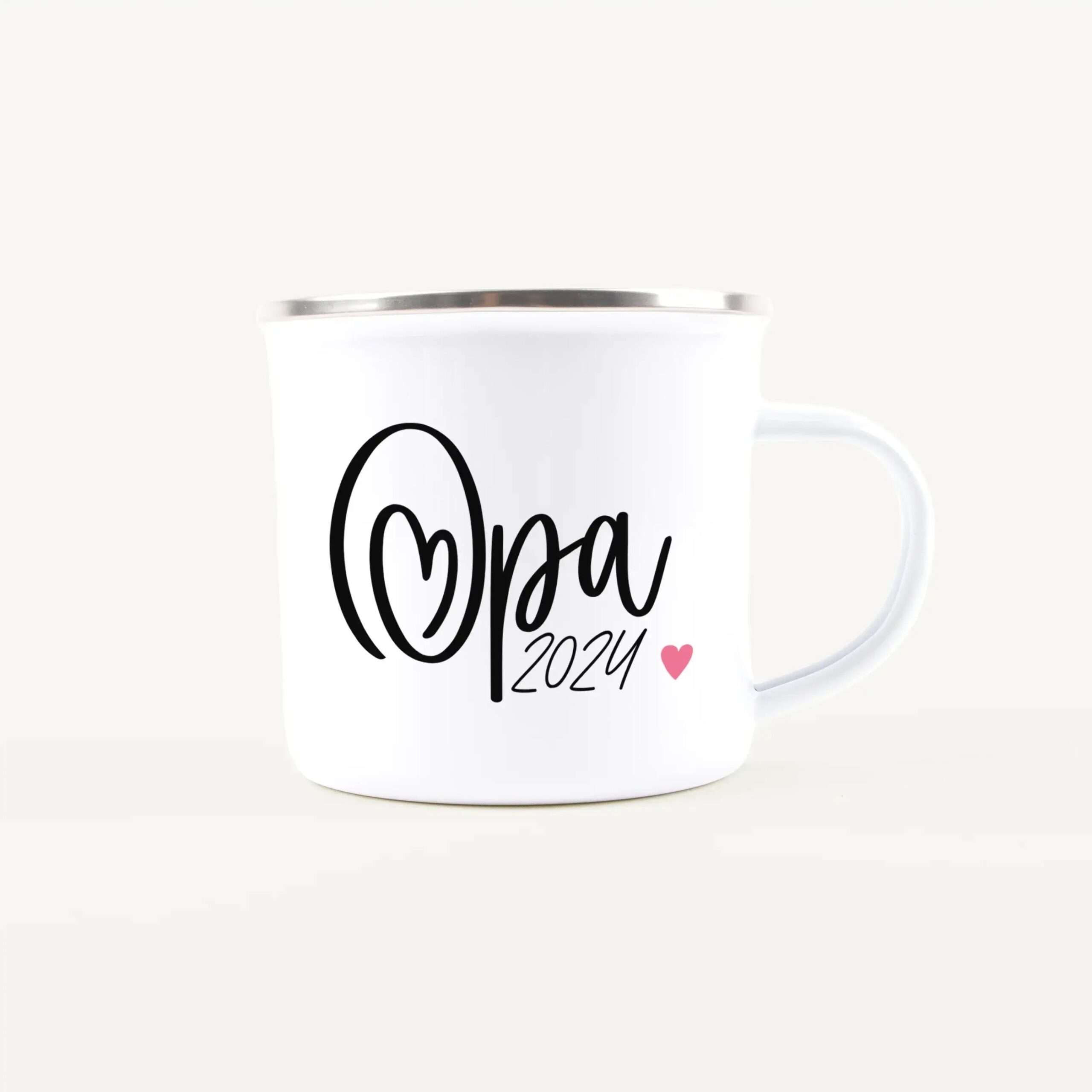 White ceramic mug with black cursive text reading 'Mona' and a small pink heart, 2024 visible at the bottom.