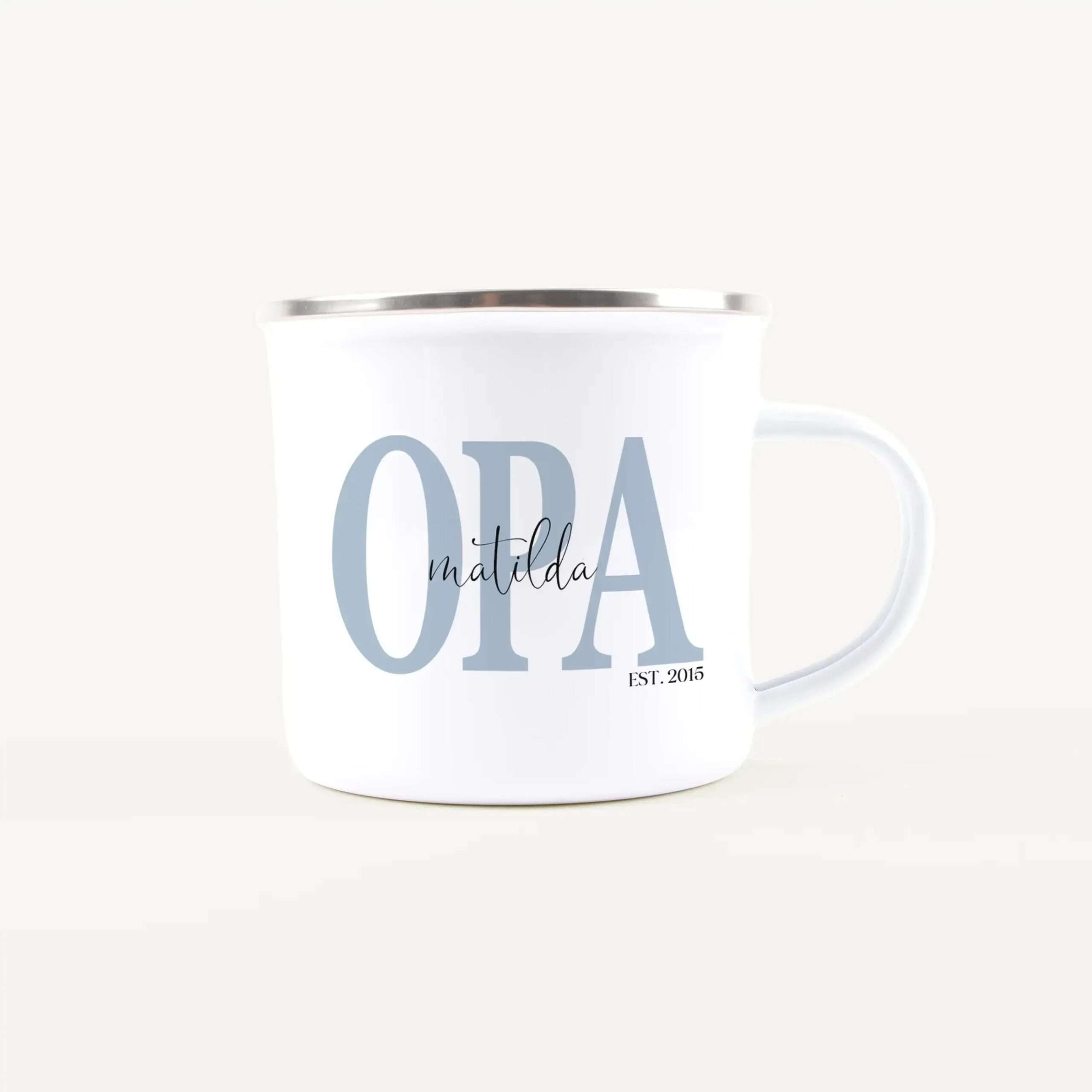 White ceramic mug with large light-blue letters forming 'OPA' and a cursive 'Hello', plus 'EST. 2015' at the bottom.