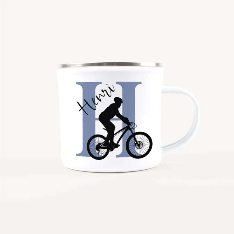 White mug with a cyclist silhouette riding a bike over a blue vertical-panel backgrounded design, conveying a cycling theme