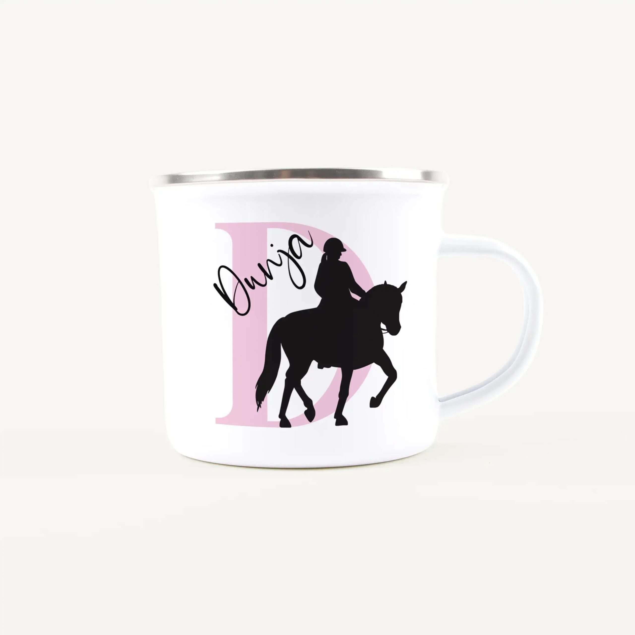White mug with a pink circular graphic showing a black silhouette of a rider on a horse and cursive text