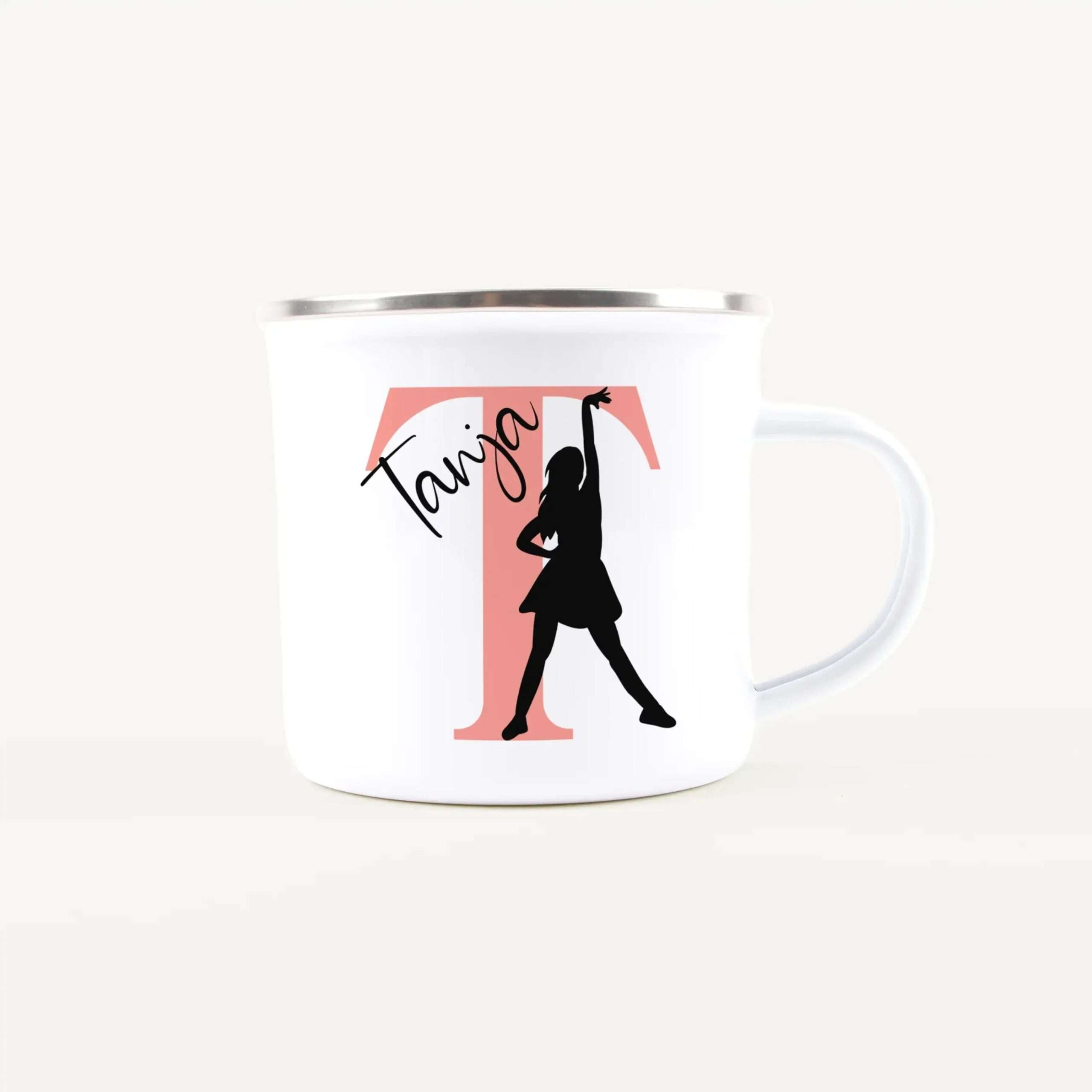 White mug featuring a black silhouette of a tango dancer over a pink rectangle with the word 'Tango' in black text.