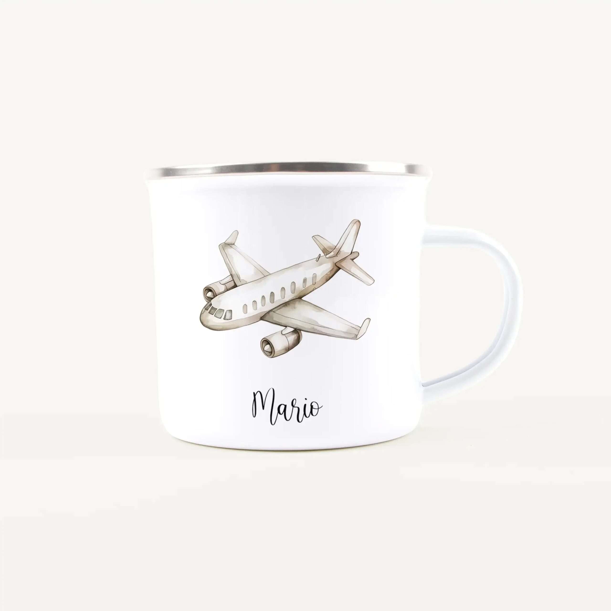 White ceramic mug with a silver rim featuring a vintage airplane illustration and the name Mario.