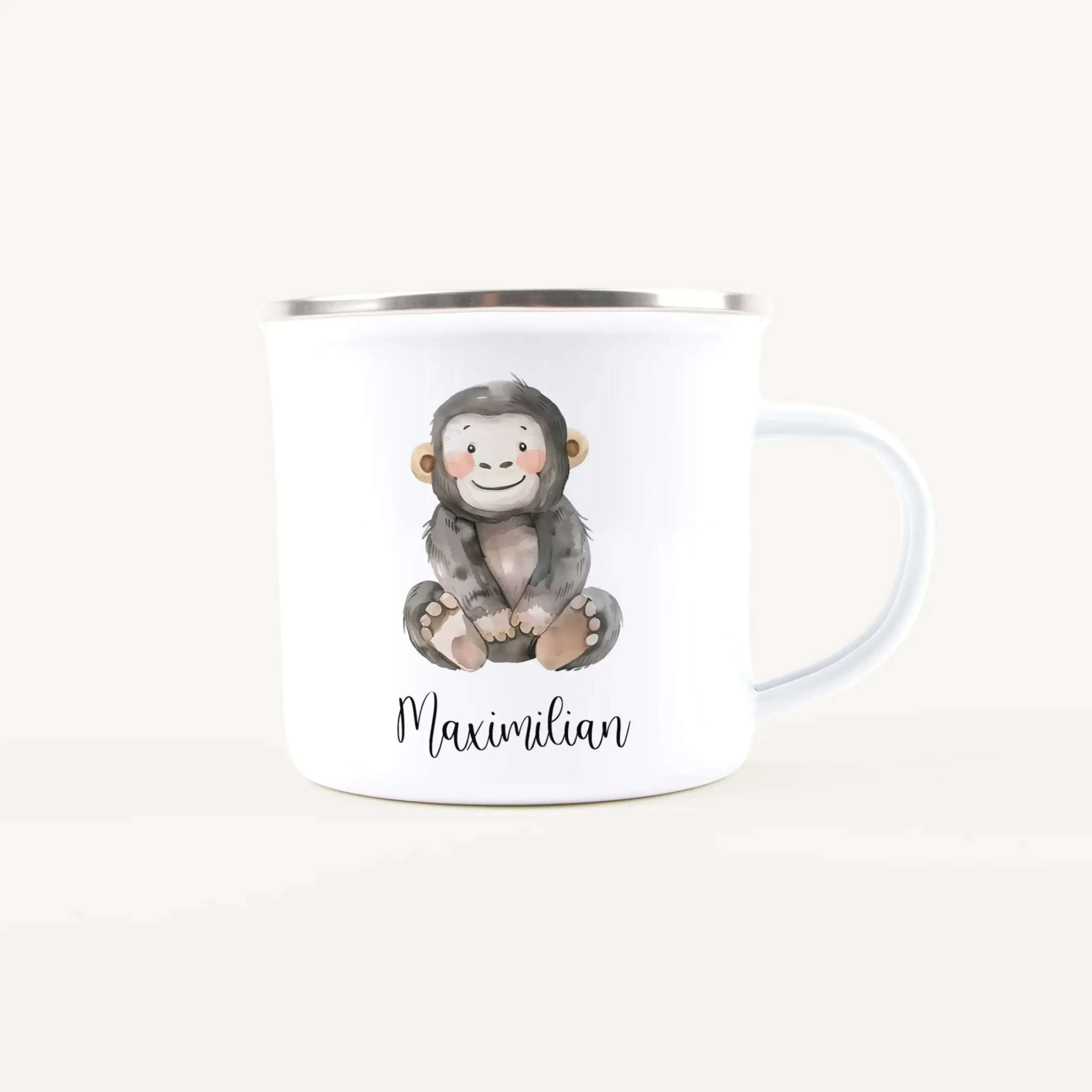 White ceramic mug featuring a cartoon monkey illustration and the name Maximilian on the front edge.