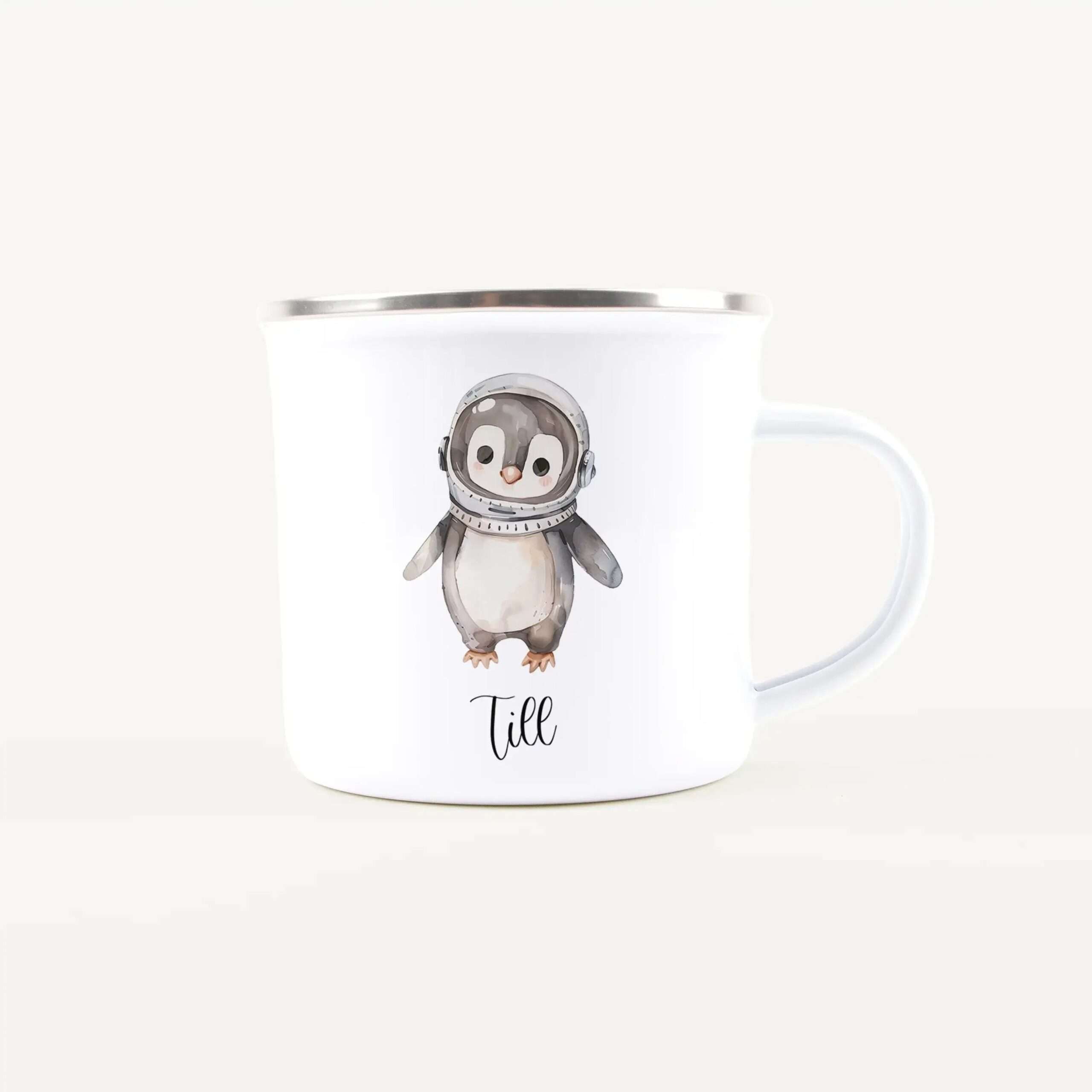 White ceramic mug featuring a cartoon penguin in an astronaut suit printed on the side.