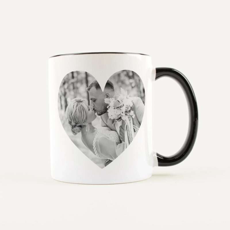White mug with a black handle featuring a heart-shaped photo window showing a couple kissing in black and white.