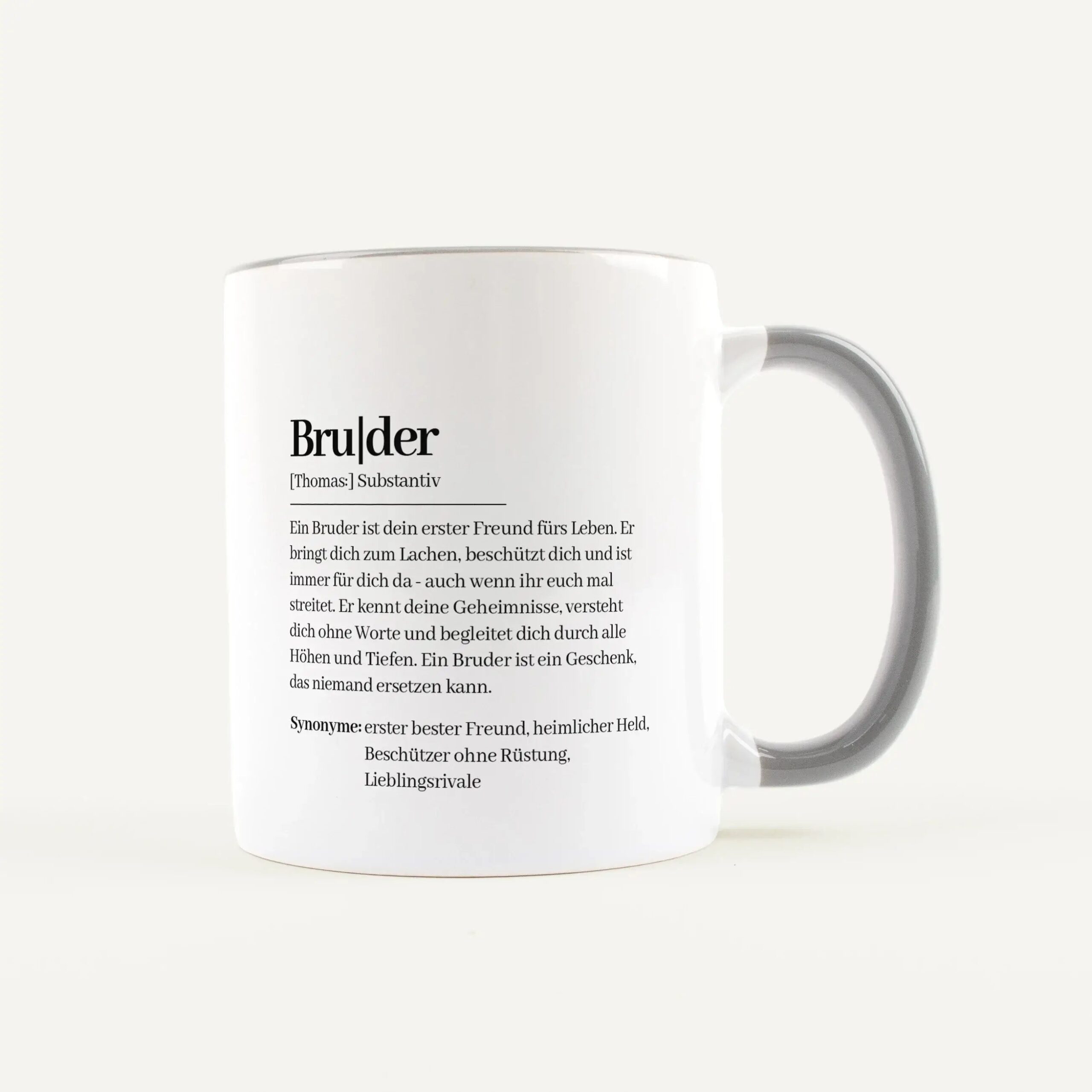 White ceramic mug featuring German text about a brother printed on its side.