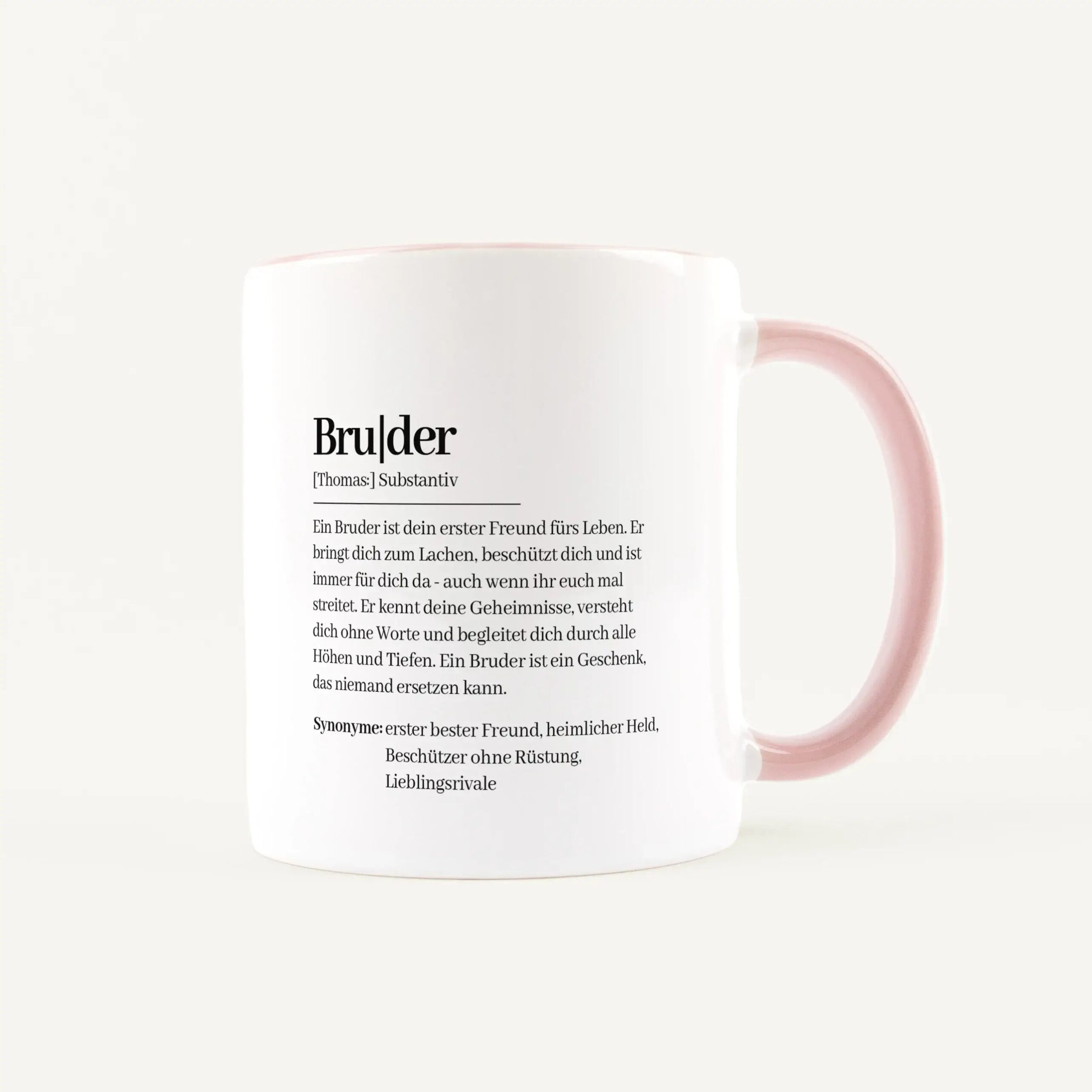 White mug with pink handle, featuring German text about the word 'Bruder' and its definitions/synonyms on the side.