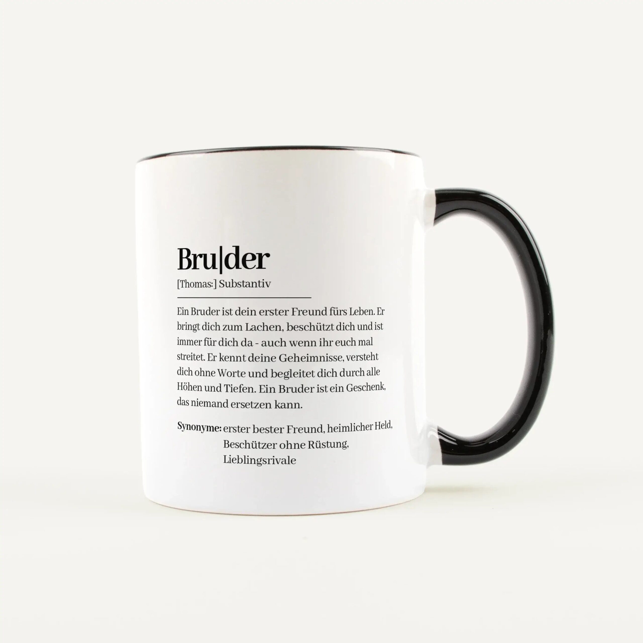White ceramic mug with a black handle, printed with a German dictionary-style text starting with 'Bruder'.
