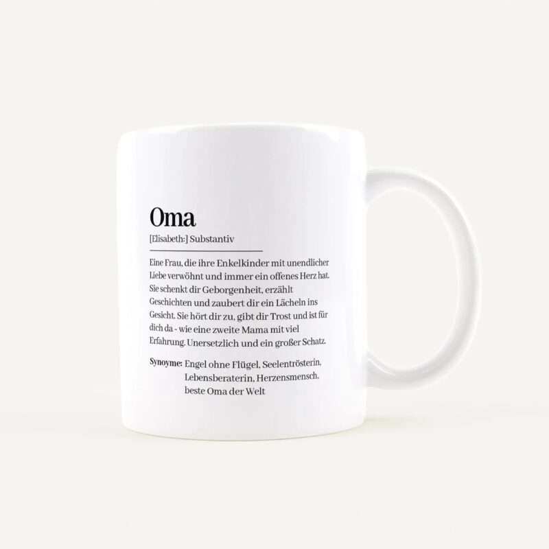 White mug with German dictionary-style definition of 'Oma' printed on its side.