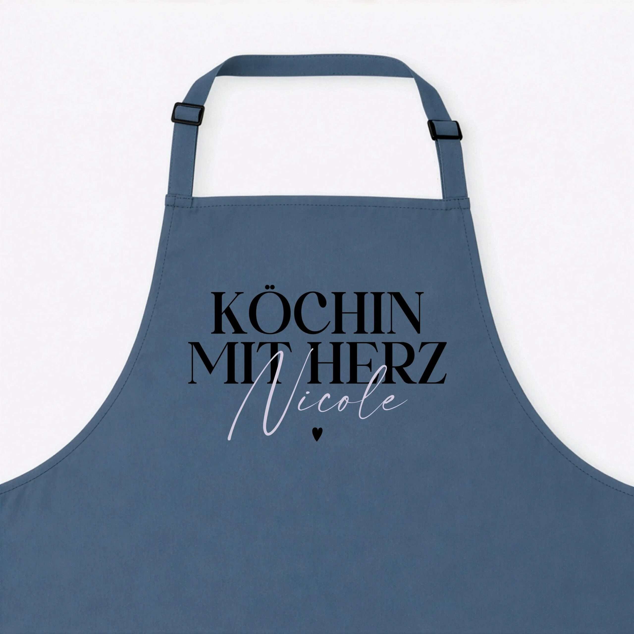 Blue apron with bold black typography reading "Köchin mit Herz" and a small heart at the bottom on a white background.