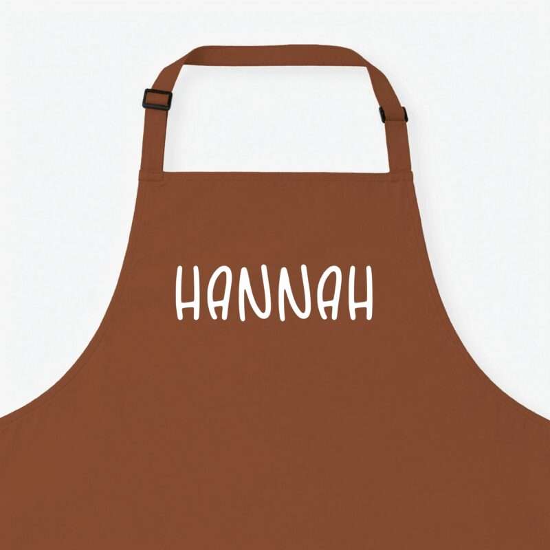 Brown apron with an adjustable neck strap and buckle, shown from chest height against a white background.
