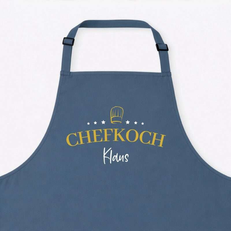 Blue apron with a yellow chef hat emblem and large yellow text across the front (CHEFKOCH).